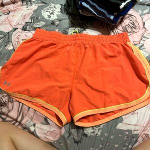 Women’s orange and yellow under armour shorts